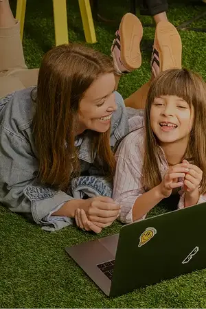 Mother and daughter lying on the floor on Turfgrass indoor artificial turf.