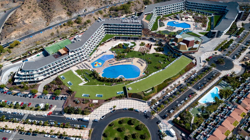 Hotel with turfgrass around pool