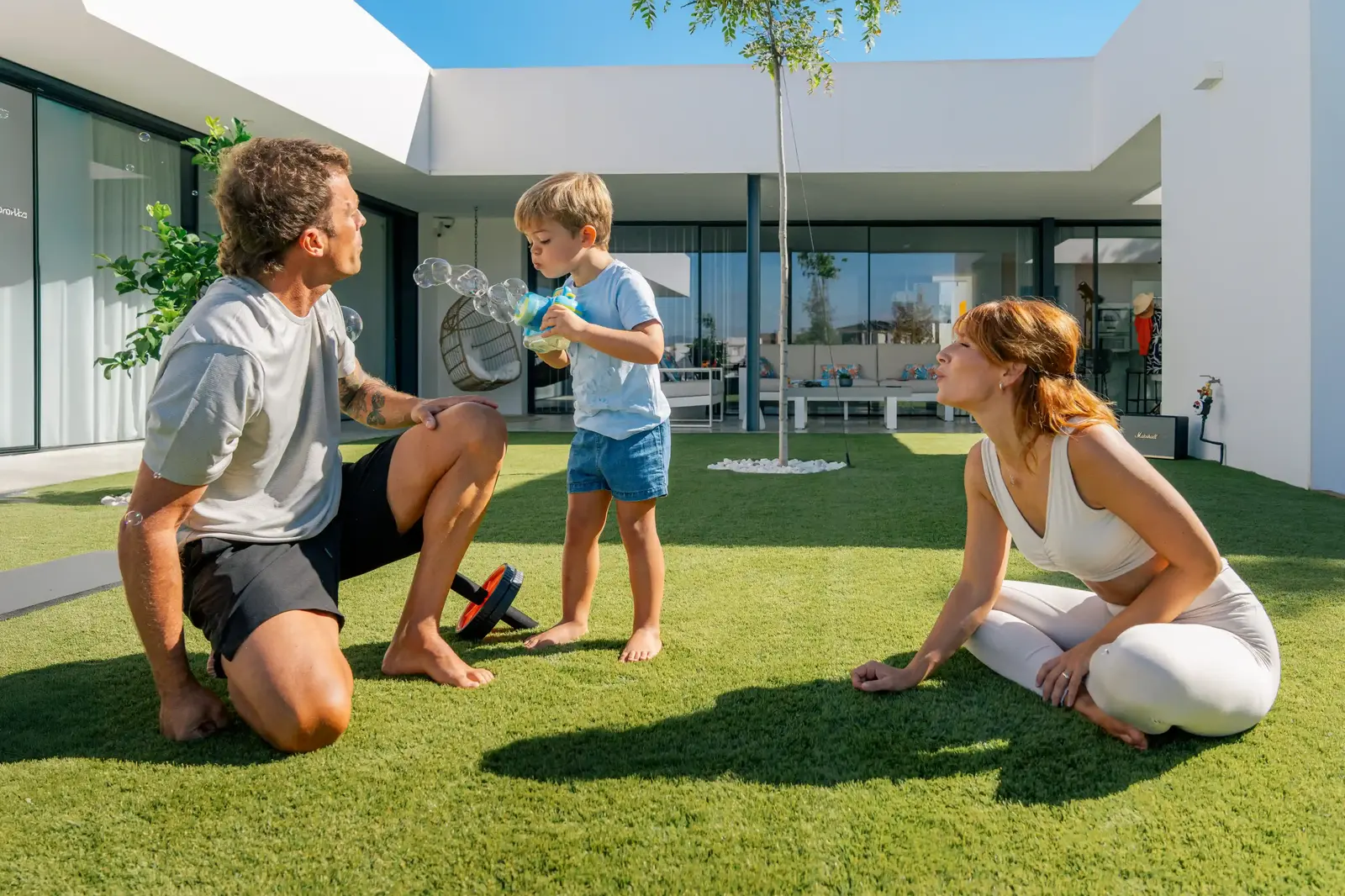  Father and son on a terrace with Turfgrass artificial grass.